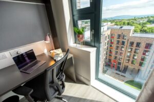 Student study desk and workspace inside UCD Village accommodation with campus view