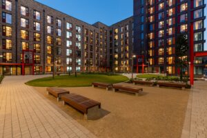 Contemporary student housing apartment buildings with courtyard seating area